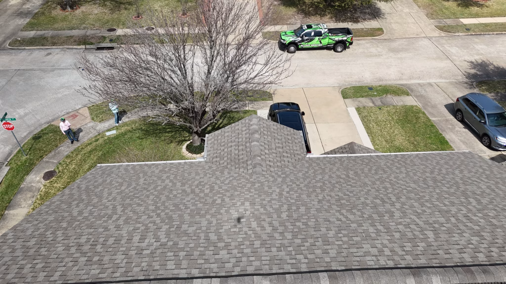 Drone view of a roof inspection on a Katy rental property during an annual rental property roof maintenance visit