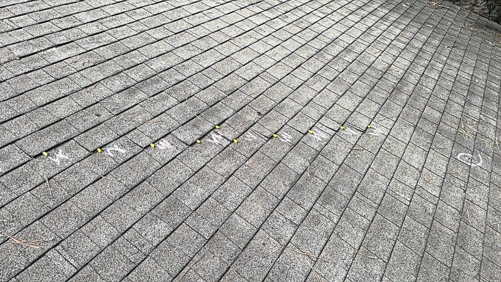 Wind Damage to shingles in the Woodlands