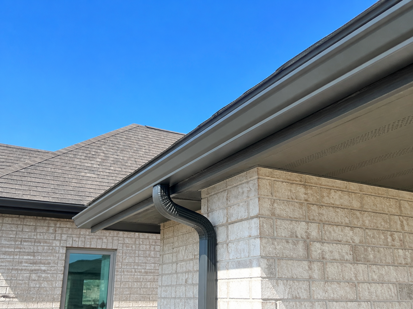 Seamless gutters installed on a home in Cypress, TX by All Out Roofing