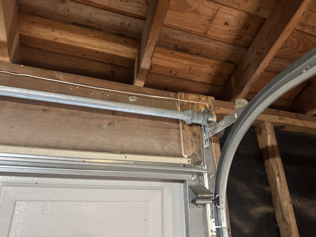 Attic radiant barrier and decking photographed on a Katy-area roofing job